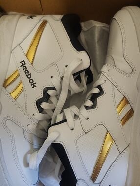 Reebok White Sneakers with Metallic Gold Stripes and Black Trim